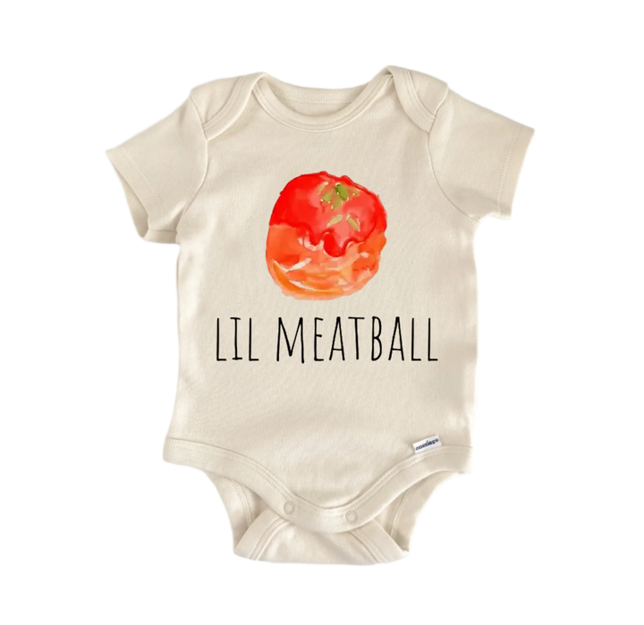 A beige baby onesie with a watercolor illustration of a tomato and the text "LIL MEATBALL" printed on it.