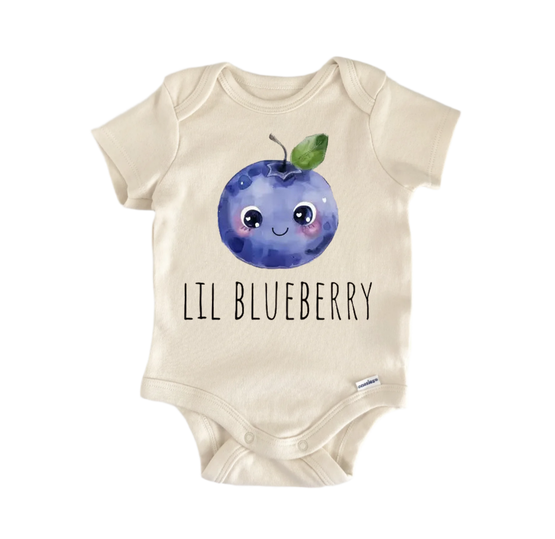 A beige baby onesie with a blueberry design and the text "LIL BLUEBERRY" printed on it.