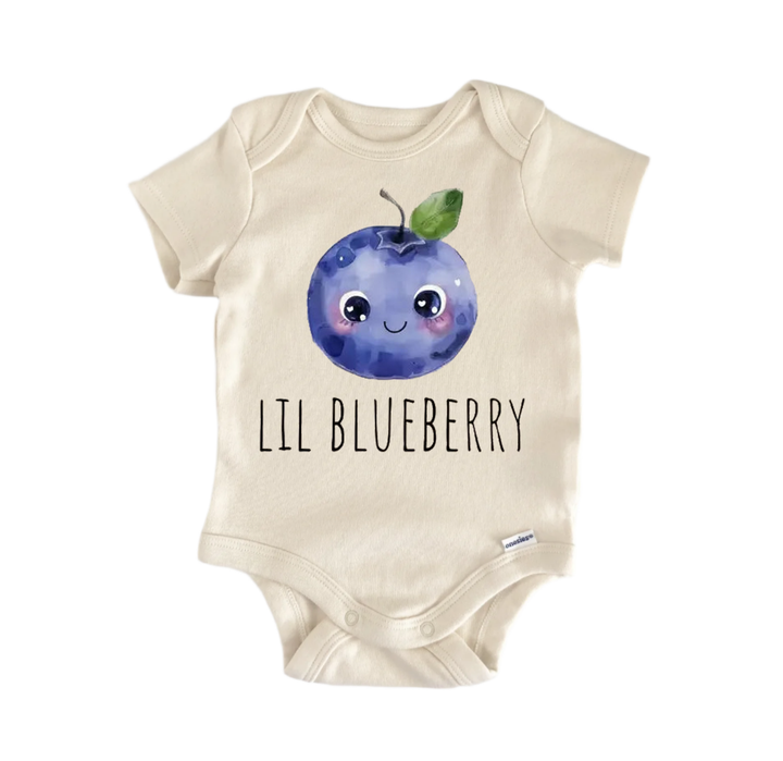 A beige baby onesie with a blueberry design and the text "LIL BLUEBERRY" printed on it.