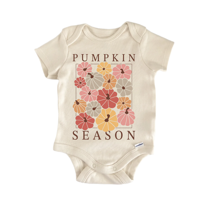 A beige baby onesie with a graphic design of pumpkins and the text "Pumpkin Season" printed on it.