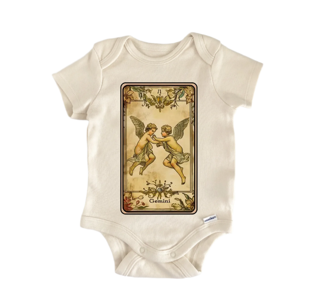 A white baby onesie with a printed design of two cherubs, which is a zodiac card for the sign of Gemini.